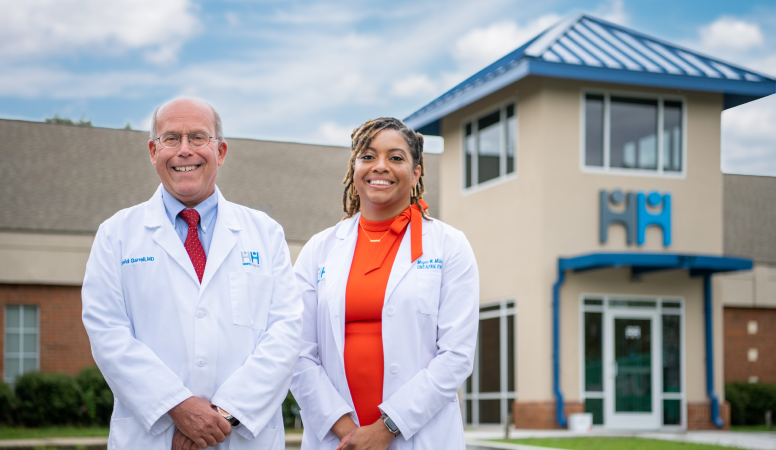 Dr. Garrell and Megan Millhouse in front of HopeHealth in Orangeburg